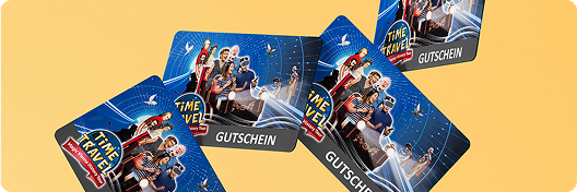 Several vouchers with the theme "Time travel" are scattered on a yellow background. The vouchers are blue and show pictures of people posing. The word "GUTSCHEIN" is printed on each card.  